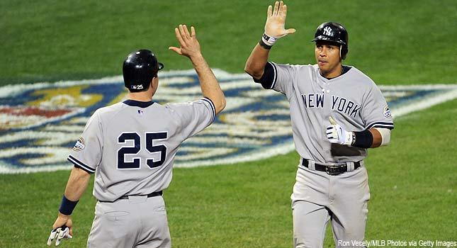 New York Yankees Derek Jeter forces out Philadelphia Phillies Ryan Howard  at second base, but Jeter is unable to turn a double play in the first  inning during Game 5 of the