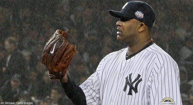 New York Yankees CC Sabathia gets a visit on the mound after allowing a  second home run to Philadelphia Phillies Chase Utley during the sixth  inning in Game 1 of the 2009