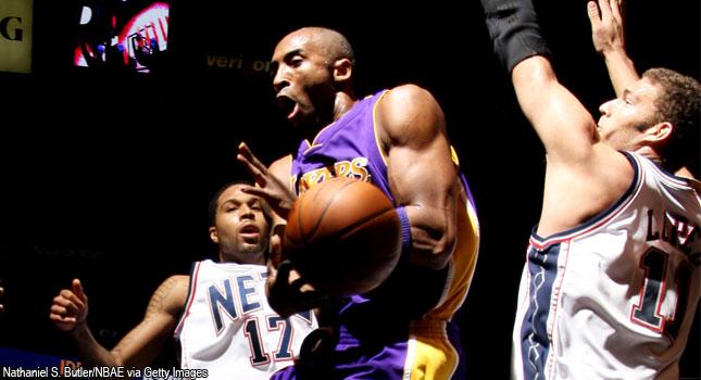 Injured guard Kobe Bryant of the Los Angeles Lakers wears an NFL