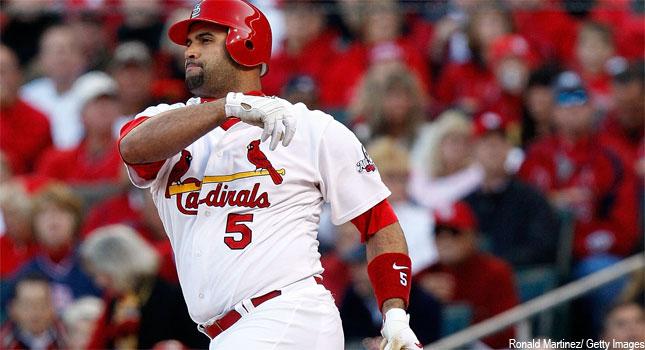 Pujols gets spring hit for Cards with wife in brain surgery