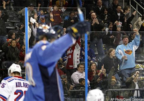 The Atlanta Thrashers mascot Thrash interacts with fans during the