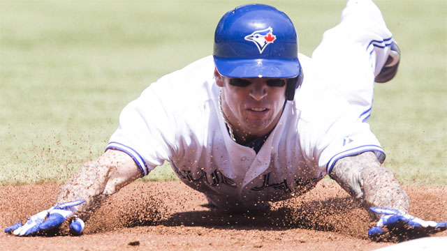 Toronto Blue Jays' Brett Lawrie keeps an eye on his hands