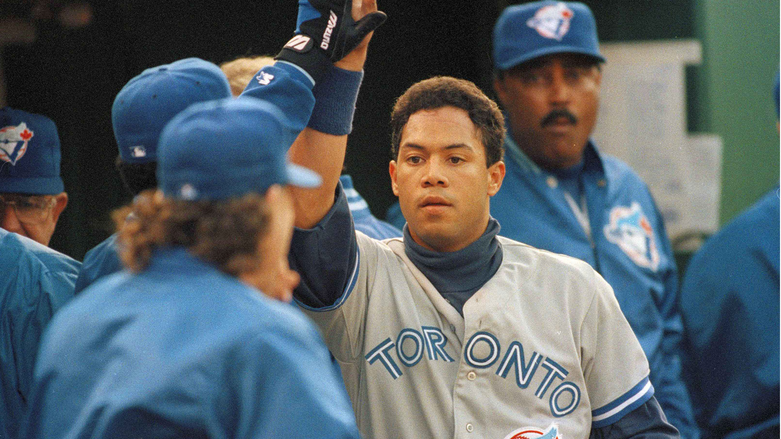 Toronto Blue Jays Paul Molitor, right, is greeted in the dugout as