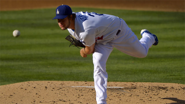 Los Angeles Dodgers starting pitcher Clayton Kershaw looks on after  striking out the side during the first inning of their baseball game  against the Tampa Bay Rays, Sunday, Aug. 11, 2013, in