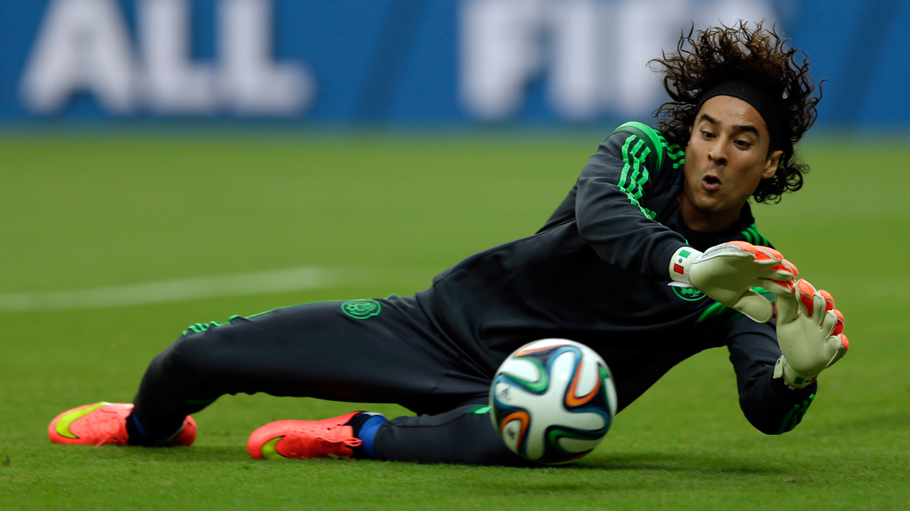 Malaga signs goalkeeper Ochoa for 3 years