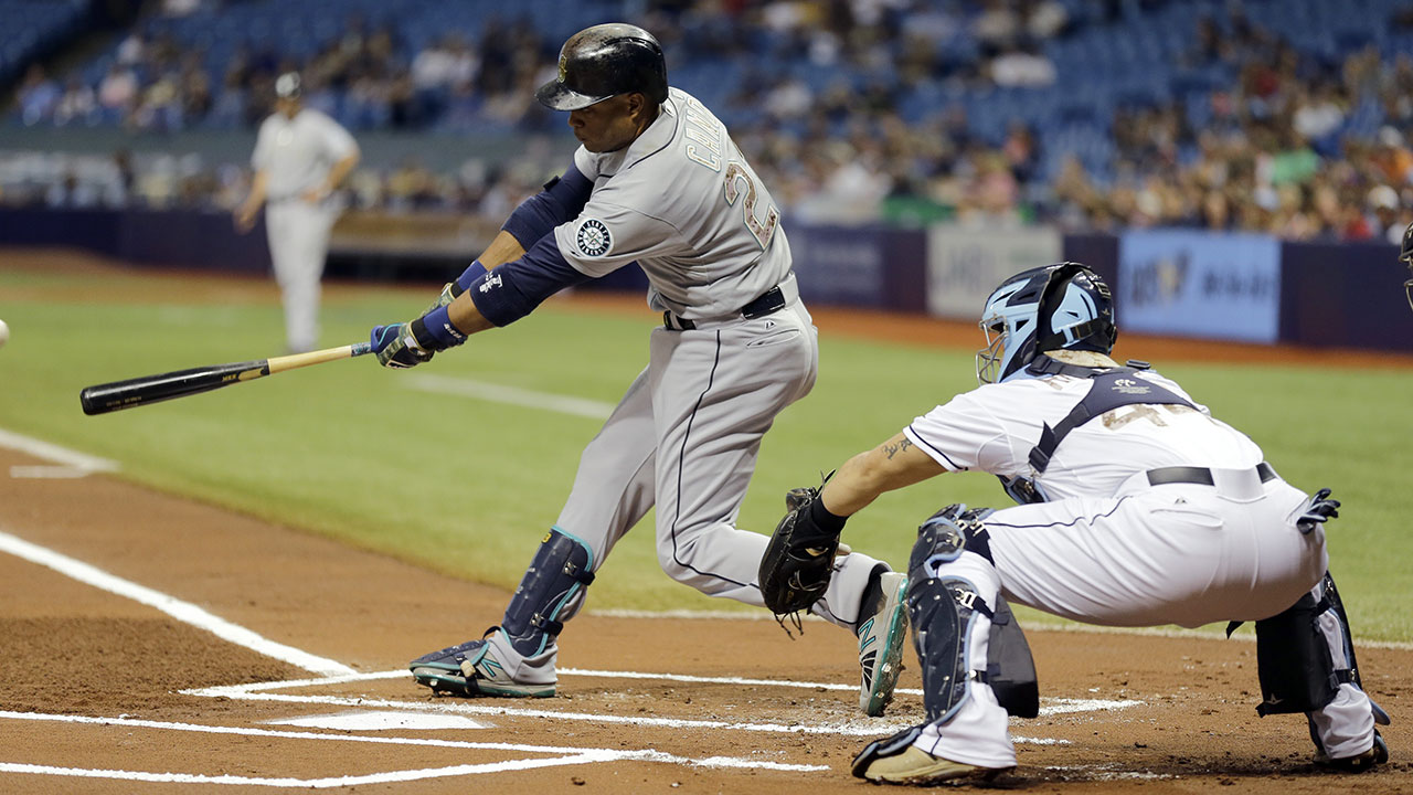 Seattle Mariners' Robinson Cano adjust his batting gloves before