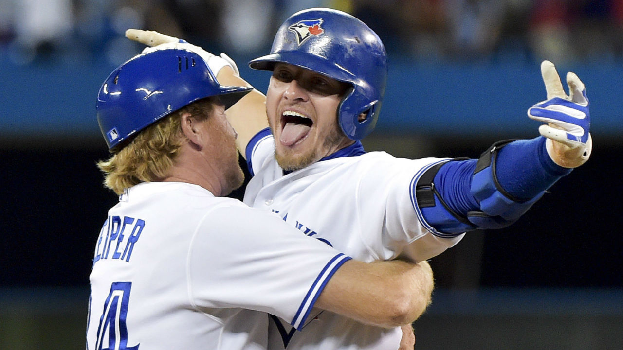 Toronto Blue Jays first baseman Justin Smoak, right, gets a handshake from  manager John Gibbons after they Blue Jays defeated the New York Yankees in  a baseball game in Toronto on Sunday