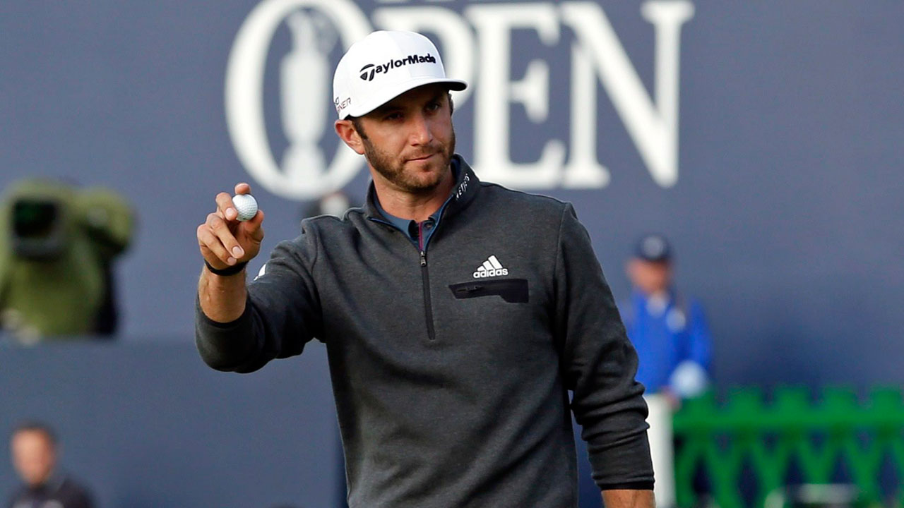 Dustin Johnson handles wind, leads British Open