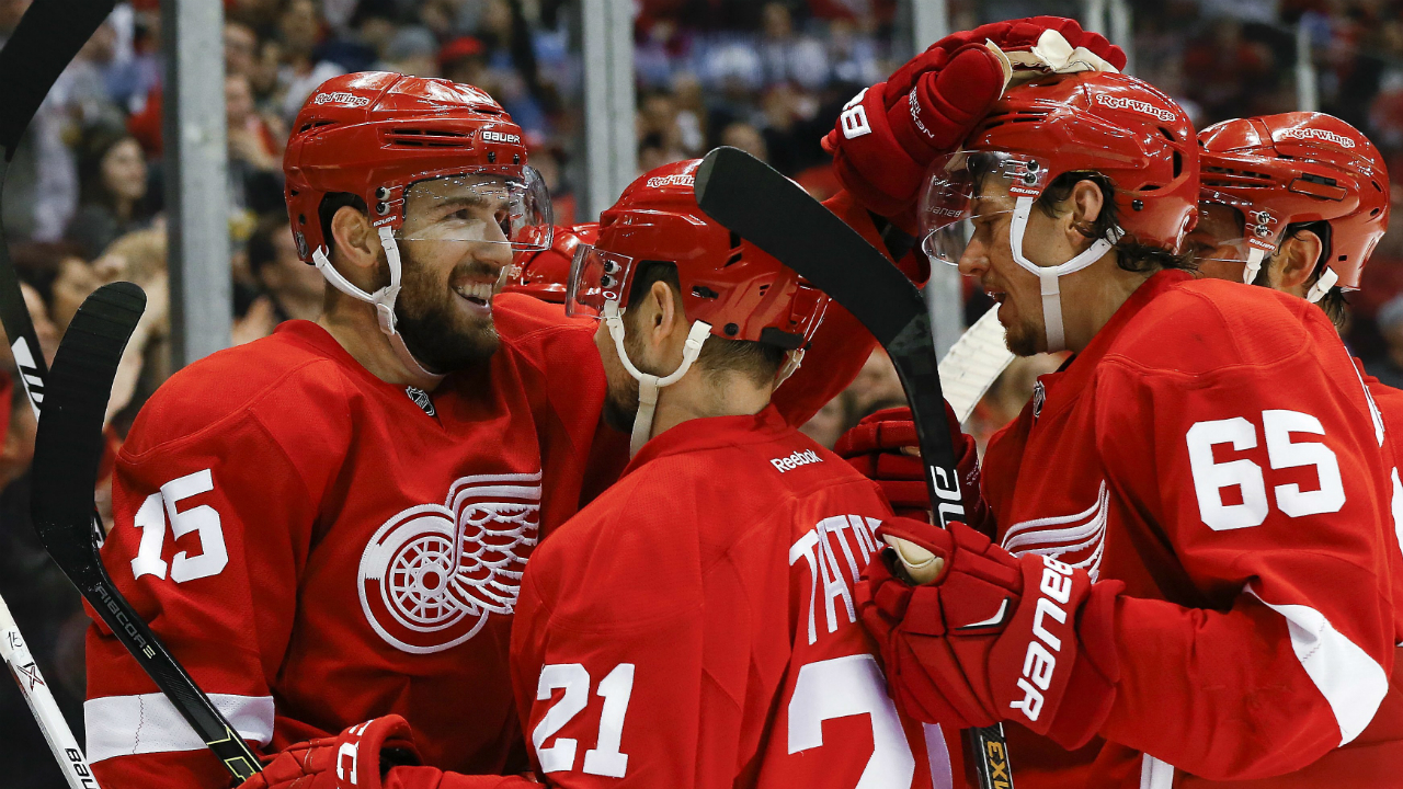 Detroit-Red-Wings-center-Riley-Sheahan-(15)-celebrates-his-goal-against-the-Buffalo-Sabres-with-Tomas-Tatar-(21)-and-Danny-DeKeyser-(65)-in-the-second-period-of-an-NHL-hockey-game,-Monday,-March-28,-2016,-in-Detroit.-(AP-Photo/Paul-Sancya)