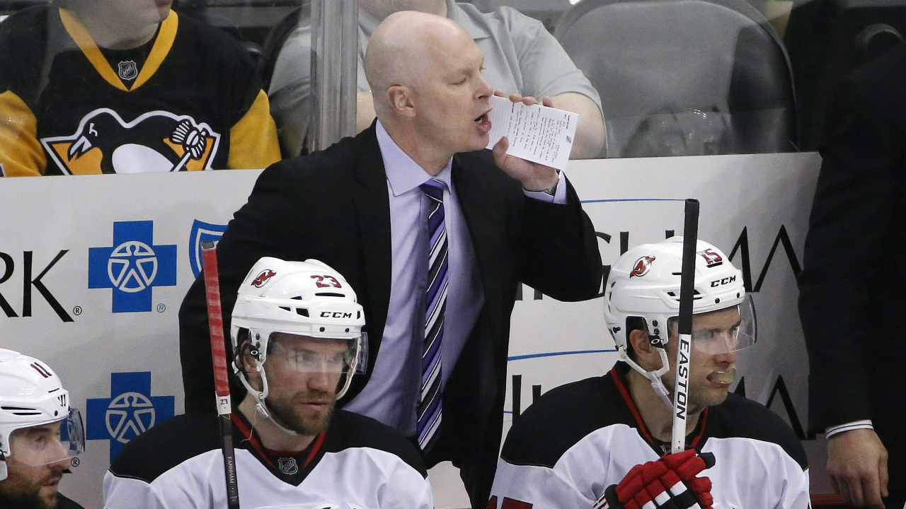 New-Jersey-Devils-head-coach-John-Hynes-yells-instructions-during-the-third-period-of-an-NHL-hockey-game-against-the-Pittsburgh-Penguins-in-Pittsburgh,-Thursday,-March-24,-2016.-The-Devils-won-3-0.-(AP-Photo/Gene-J.-Puskar)