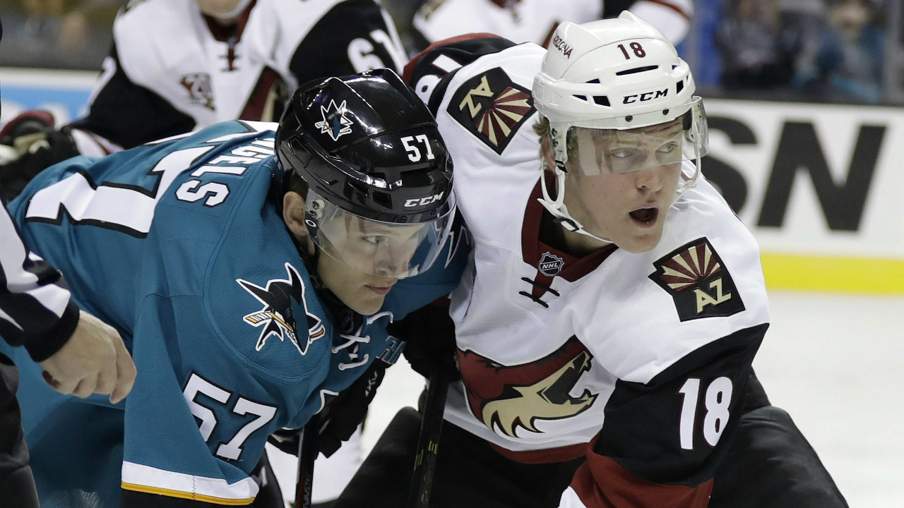 San-Jose-Sharks'-Tommy-Wingels-(57)-faces-off-against-Arizona-Coyotes'-Christian-Dvorak-during-the-first-period-of-an-NHL-preseason-hockey-game-Friday,-Sept.-30,-2016,-in-San-Jose,-Calif.-(AP-Photo/Marcio-Jose-Sanchez)