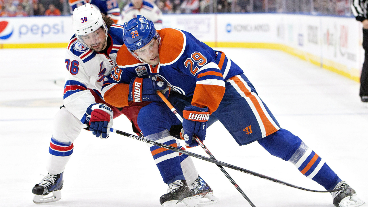 New-York-Rangers'-Mats-Zuccarello-(36)-and-Edmonton-Oilers'-Leon-Draisaitl-(29)-battle-for-the-puck-during-second-period-NHL-action-in-Edmonton,-Alta.,-on-Sunday-November-13,-2016.-(Jason-Franson/CP)