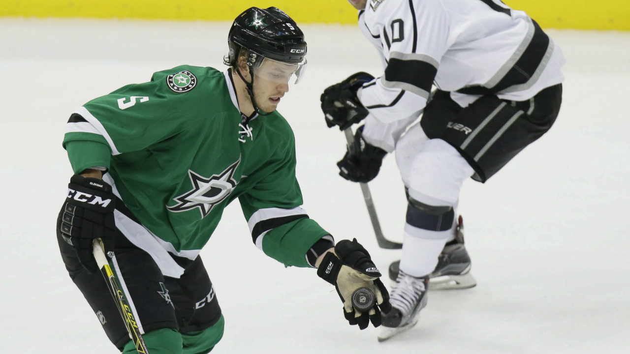 Dallas-Stars-defenceman-Jamie-Oleksiak-(5)-catches-the-puck-in-front-of-Los-Angeles-Kings-right-wing-Devin-Setoguchi-(10)-during-the-second-period-of-an-NHL-hockey-game-in-Dallas,-Friday,-Dec.-23,-2016.-(LM-Otero/AP)