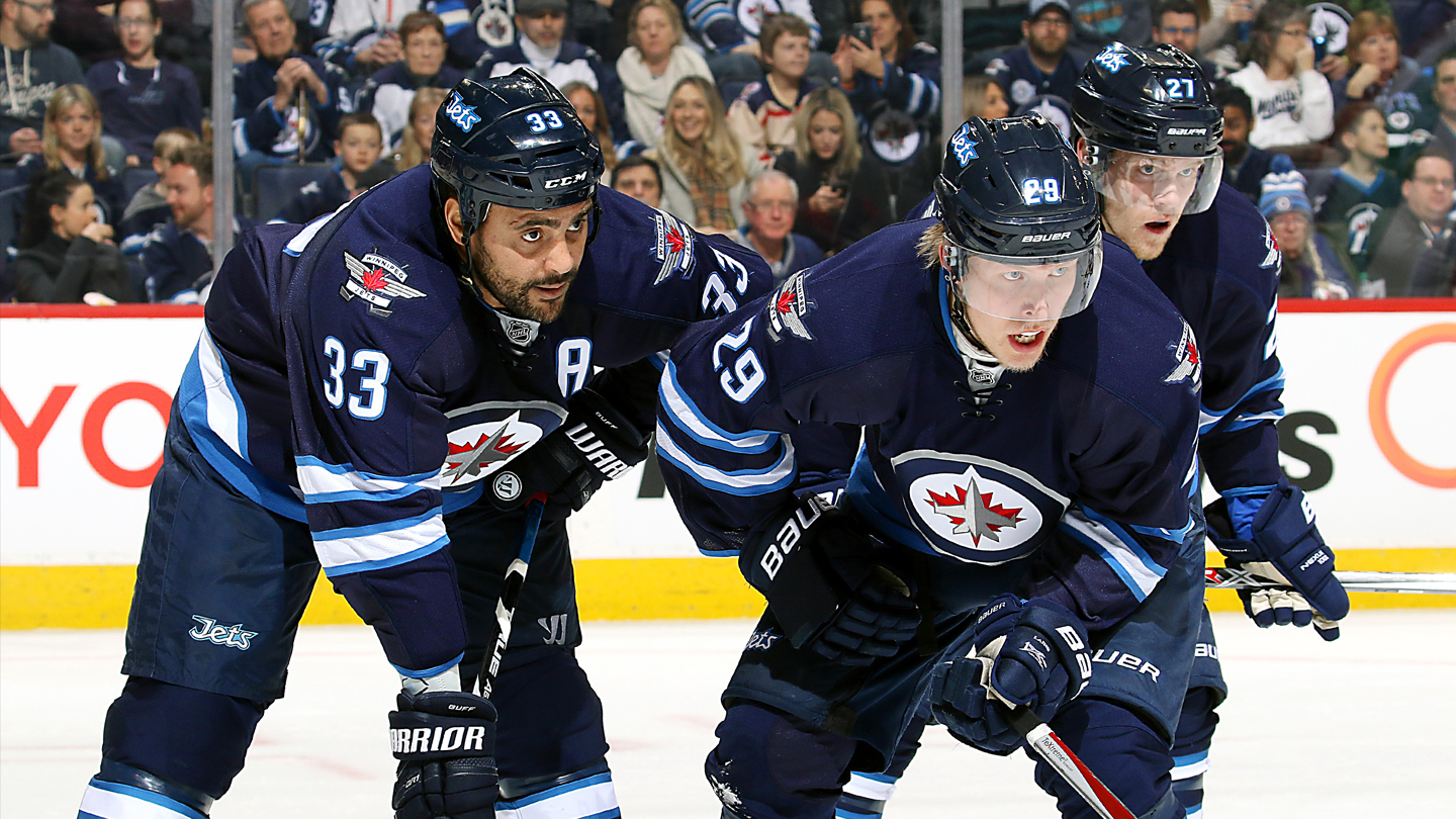 Winnipeg Jets defenseman Dustin Byfuglien (33) keeps the away from