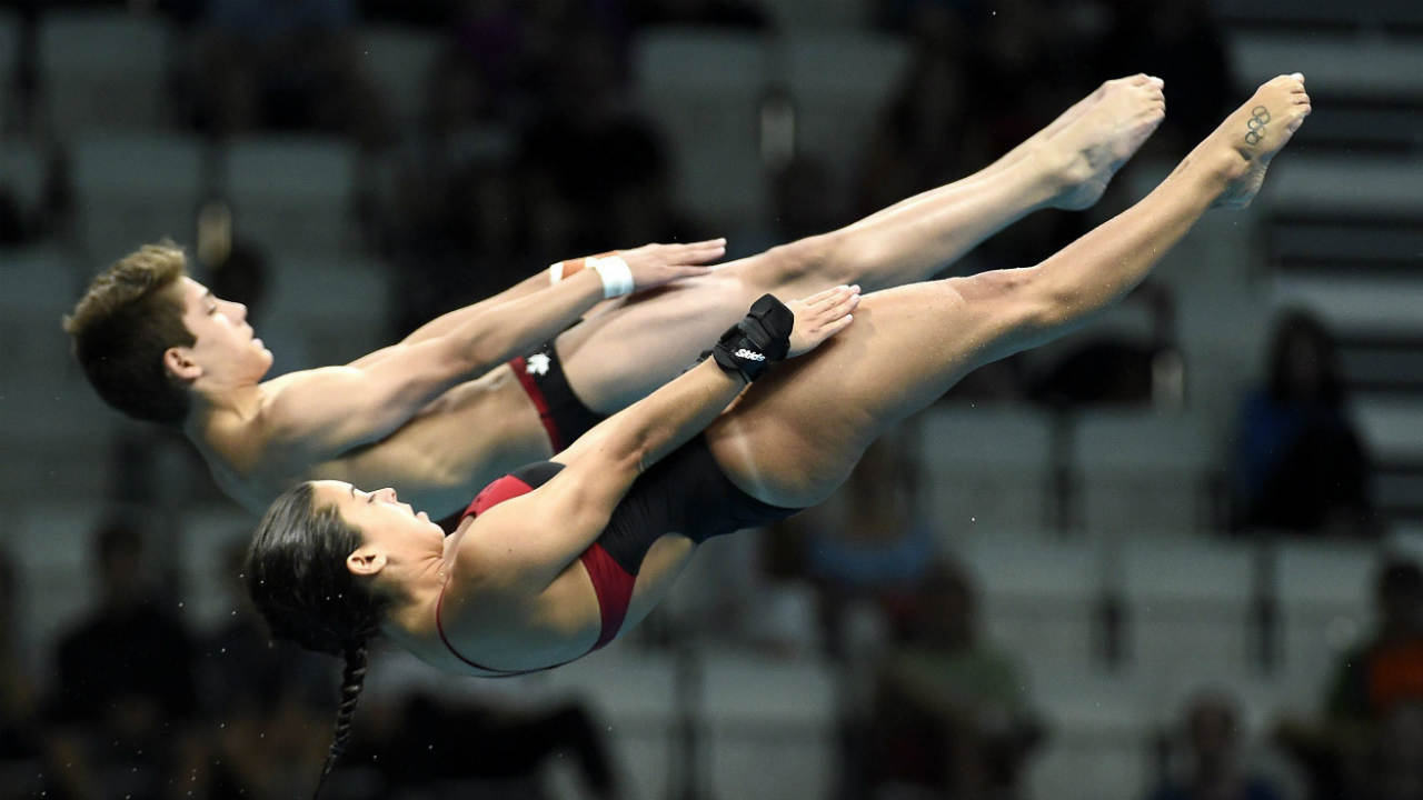 Meaghan-Benfeito-and-Nathan-Zsombor-Murray-of-Canada-compete-in-the-mixed-diving-10m-synchronised-platform-final-st-the-Swimming-World-Championships-2017-in-Duna-Arena-in-Budapest,-Hungary,-Saturday,-July-15,-2017.-(Balazs-Czagany/MTI-via-AP)