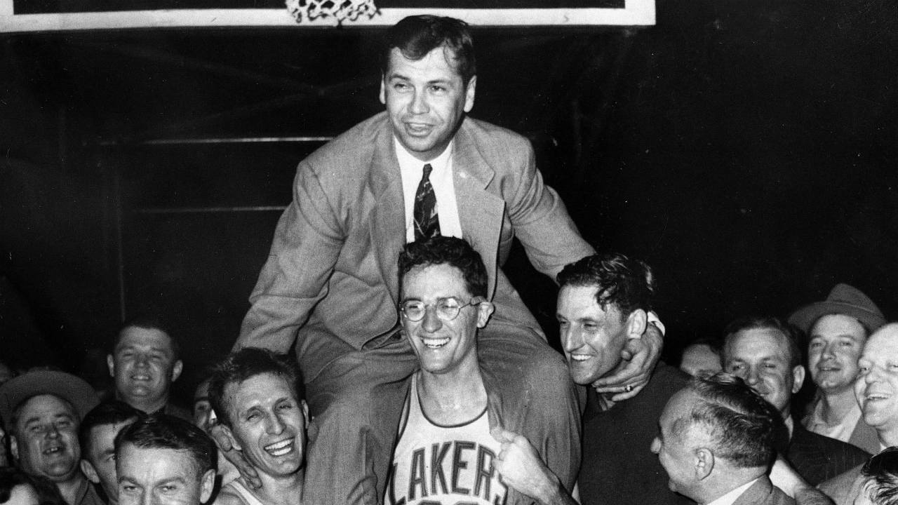 In-this-April-25,-1952,-file-photo,-Minneapolis-Lakers-coach-John-Kundla,-top,-is-hoisted-up-by-players-and-carried-to-their-dressing-room-after-beating-the-New-York-Knickerbockers-82-65-to-win-their-fourth-NBA-basketball-championship-in-five-years.-(AP-Photo,-File)