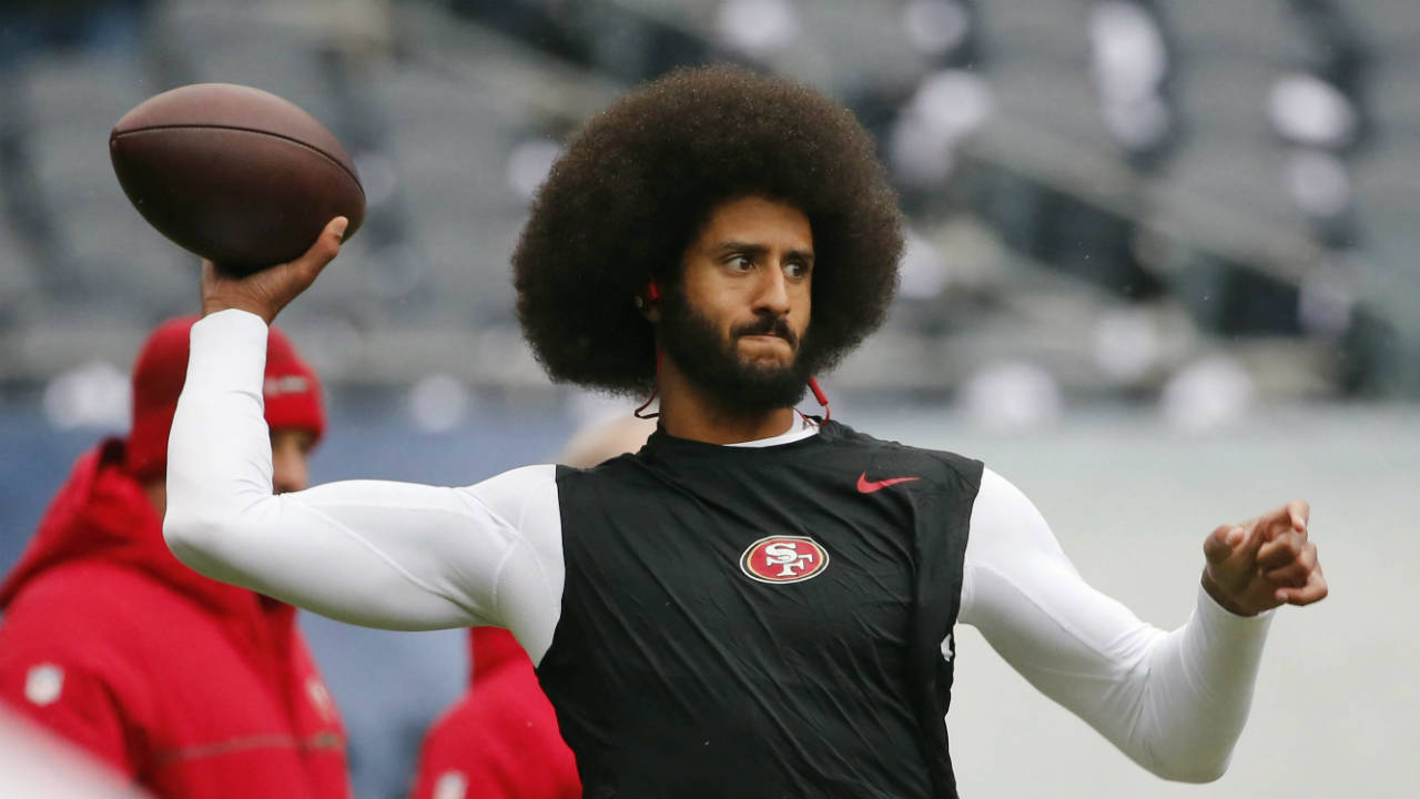 Colin-Kaepernick-warms-up-before-an-NFL-football-game-against-the-Chicago-Bears.-(Charles-Rex-Arbogast,-File/AP)