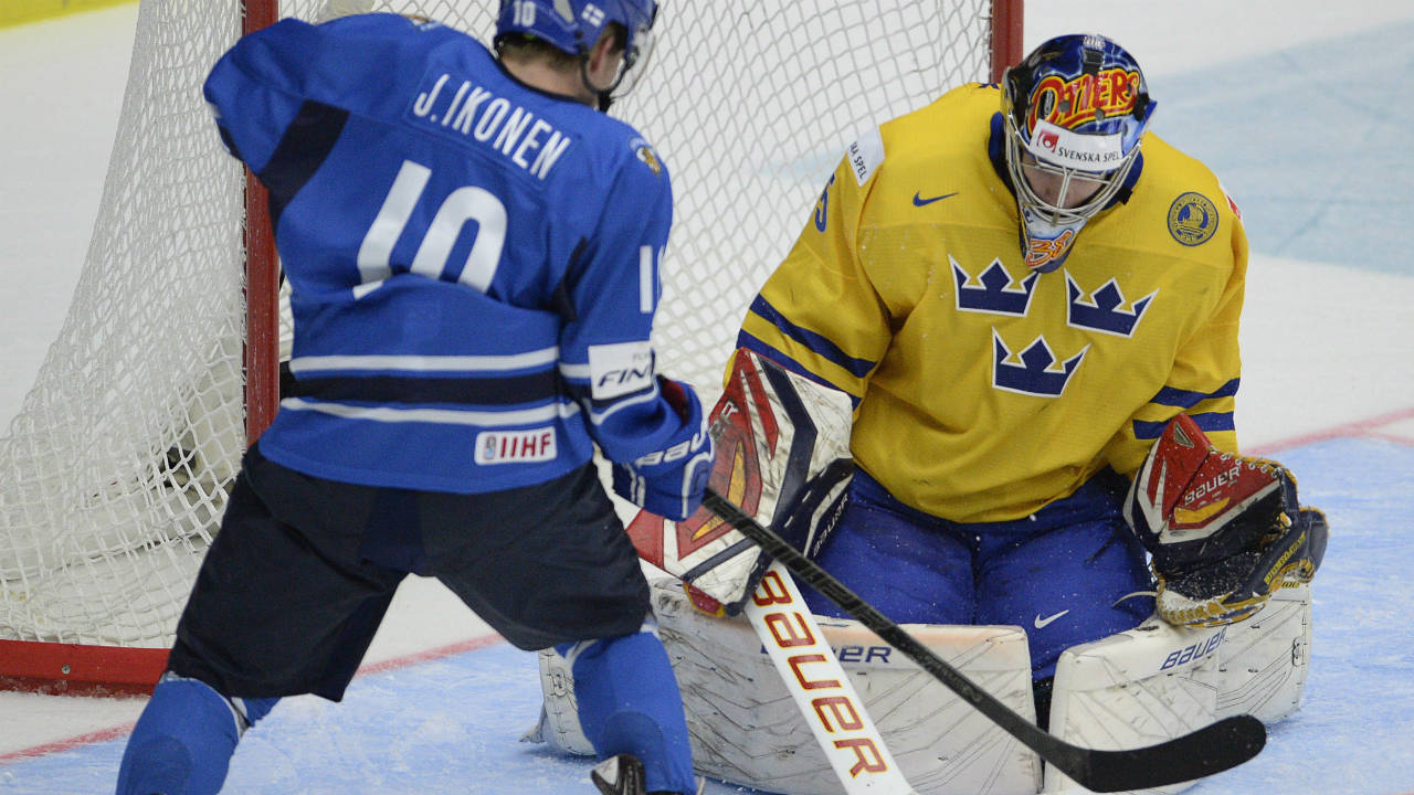 Sweden-goaltender-Oscar-Dansk-makes-a-save-on-Finland's-Jusso-Ikonen-during-gold-medal-game-action-at-the-IIHF-World-Junior-Hockey-Championship-in-Malmo,-Sweden-on-Sunday,-January-5,-2014.-(Frank-Gunn/CP)