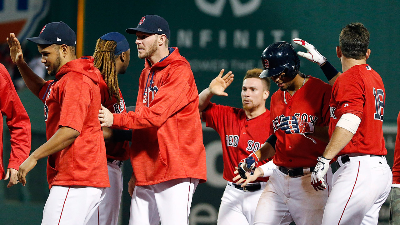 The-Boston-Red-Sox-celebrate-after-winning-over-the-New-York-Yankees-on-a-walk-by-Andrew-Benintendi.-(Michael-Dwyer/AP)