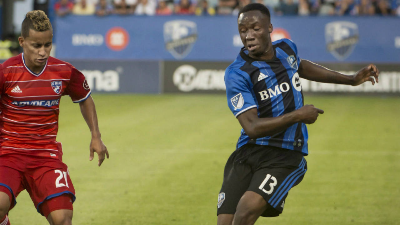 Montreal-Impact's-Ballou-Tabla-makes-a-pass-as-FC-Dallas'-Michael-Barrios,-defends-during-first-half-MLS-action-in-Montreal-on-Saturday,-July-22,-2017.-(Peter-McCabe/CP)