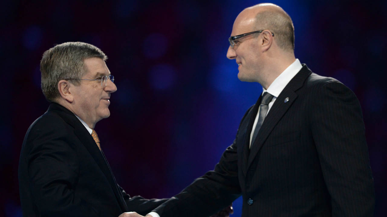 International-Olympic-Committee-President-Thomas-Bach,-left,-shakes-hands-with-KHL-president-Dmitry-Chernyshenko.-(Jung-Yeon-je,-Pool/AP)