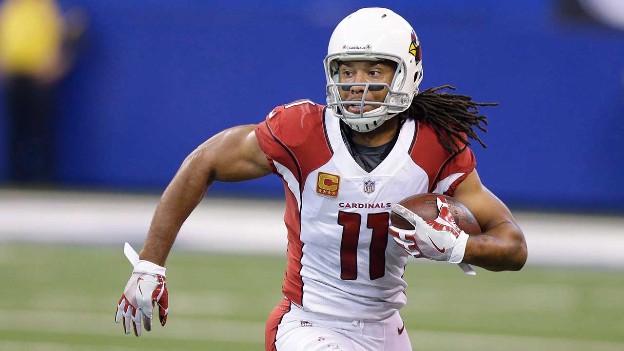 Arizona Cardinals Larry Fitzgerald (11) pushes St. Louis Rams Mike