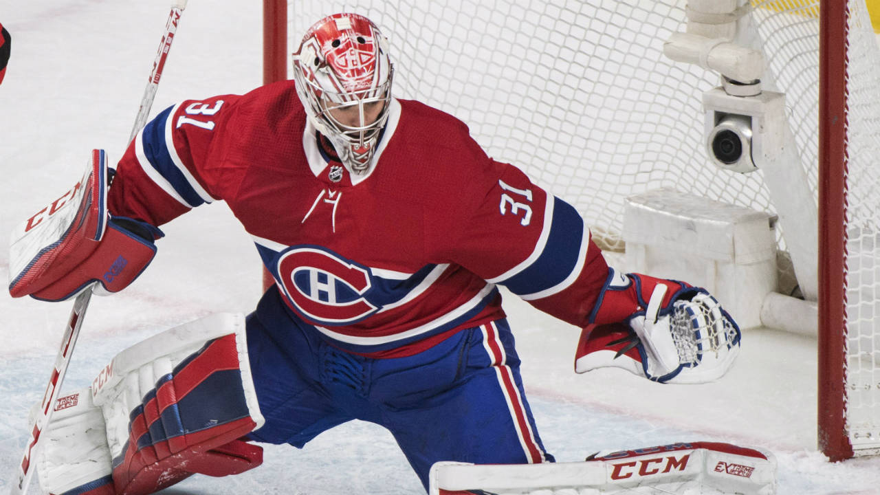 Montreal-Canadiens-goaltender-Carey-Price-makes-a-save-against-the-New-Jersey-Devils-during-first-period-NHL-hockey-action-in-Montreal,-Sunday,-April-1,-2018.-(Graham-Hughes/CP)