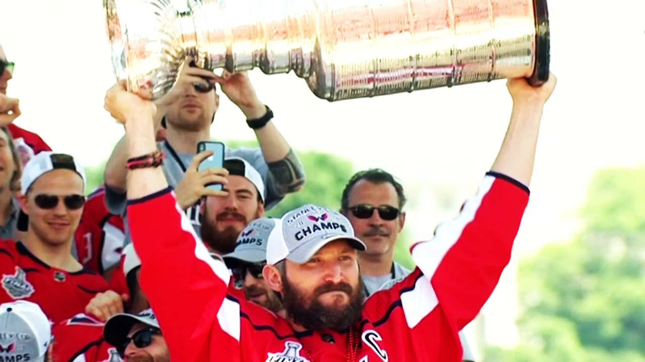 Washington Capitals' T.J. Oshie chugs a beer through his jersey at Stanley  Cup rally 