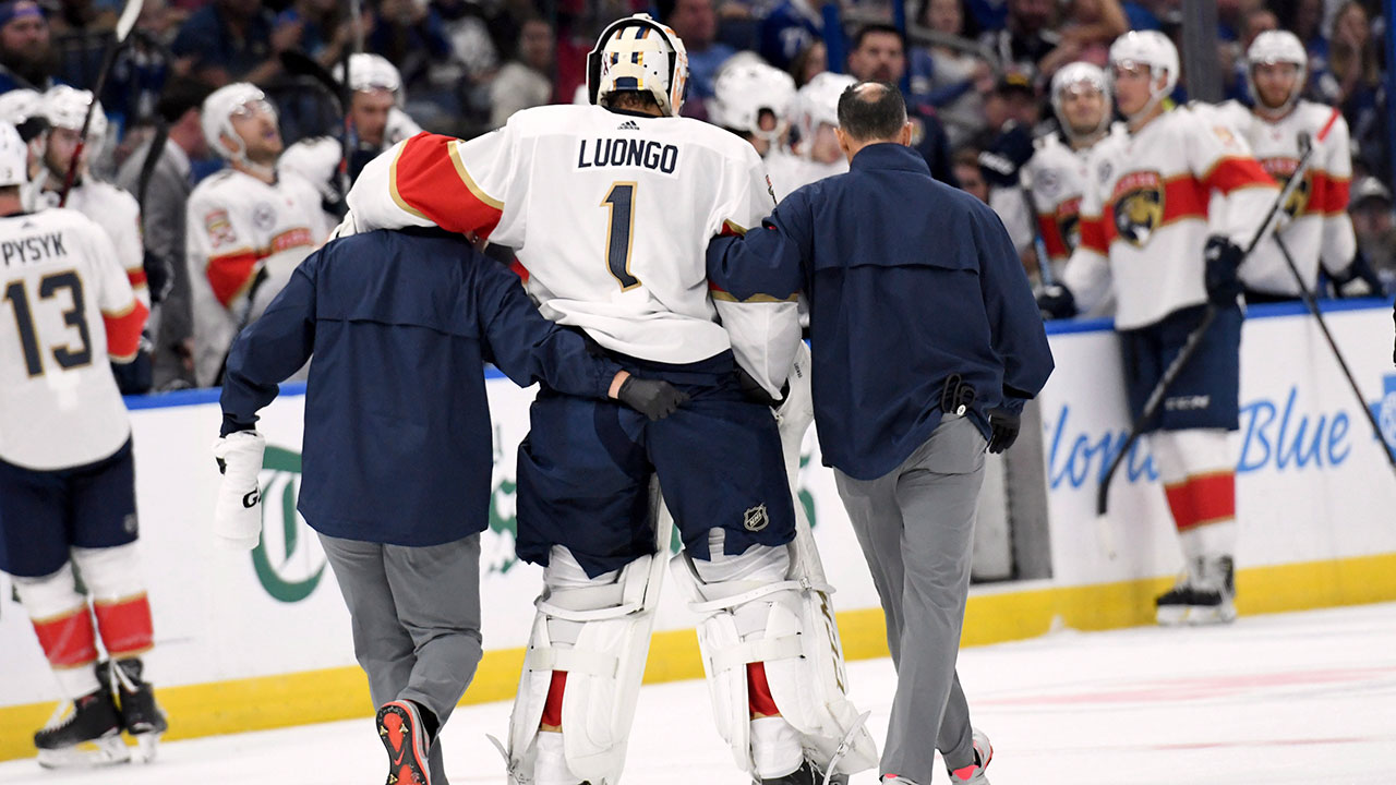 roberto_luongo_is_helped_off_the_ice