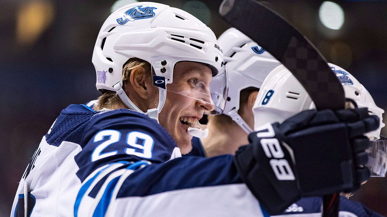 patrik-laine-celebrates-a-goal-with-winnipeg-jets-teammates