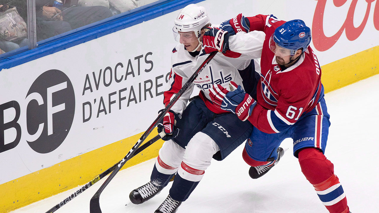 Montreal Canadiens' Xavier Ouellet, right, and Washington Capitals Michael Sgarbossa battle for the puck. (Jacques Boissinot/CP)