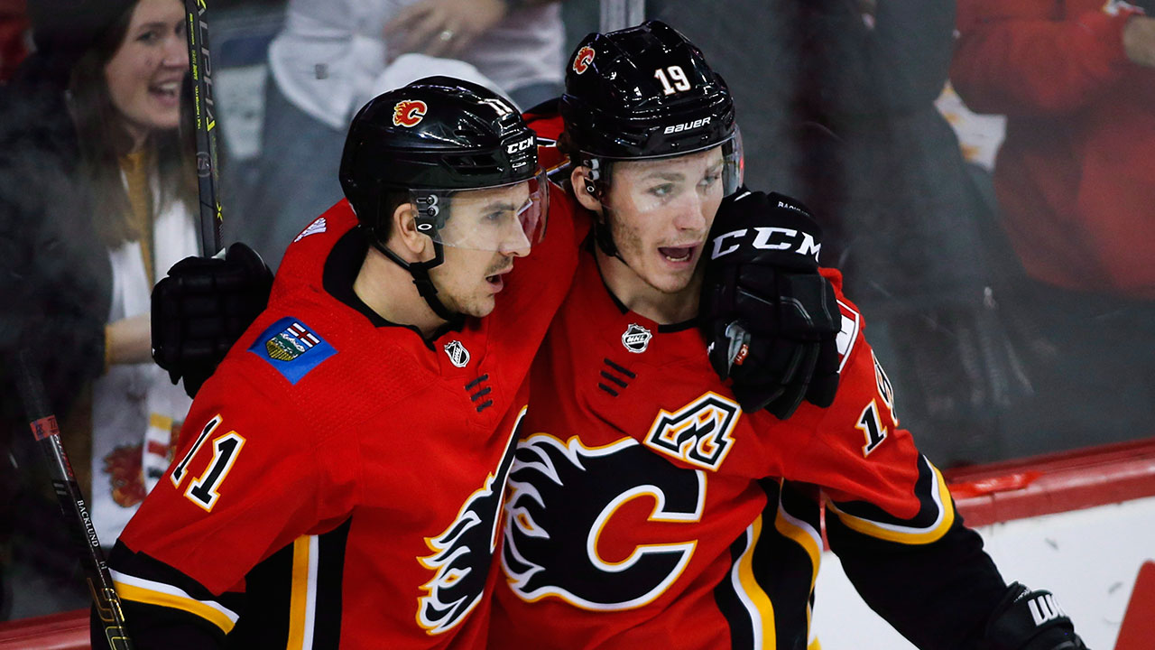 Flames burn red hot Dogs with overtime tally