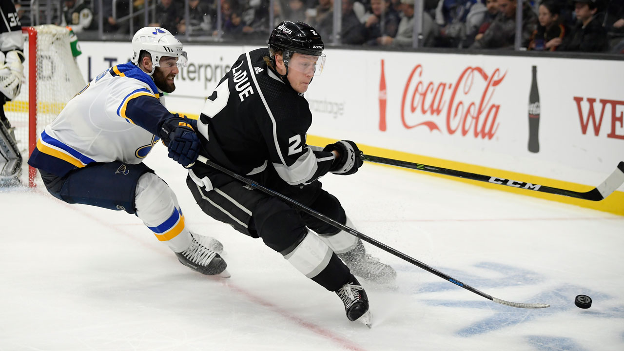 St. Louis Blues left wing Pat Maroon, left, reaches in on Los Angeles Kings defenseman Paul LaDue during the third period of an NHL hockey game.
 (Mark J. Terrill/AP)