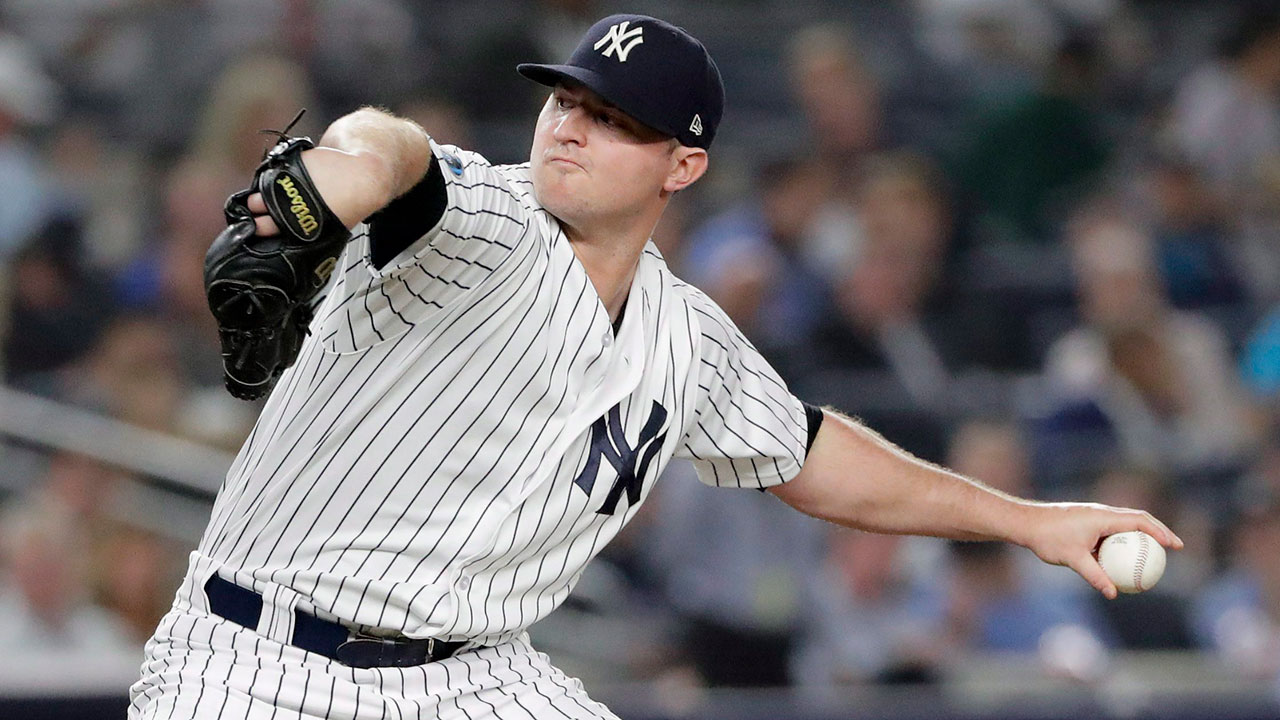 New York Yankees pitcher Zack Britton walks off the field after