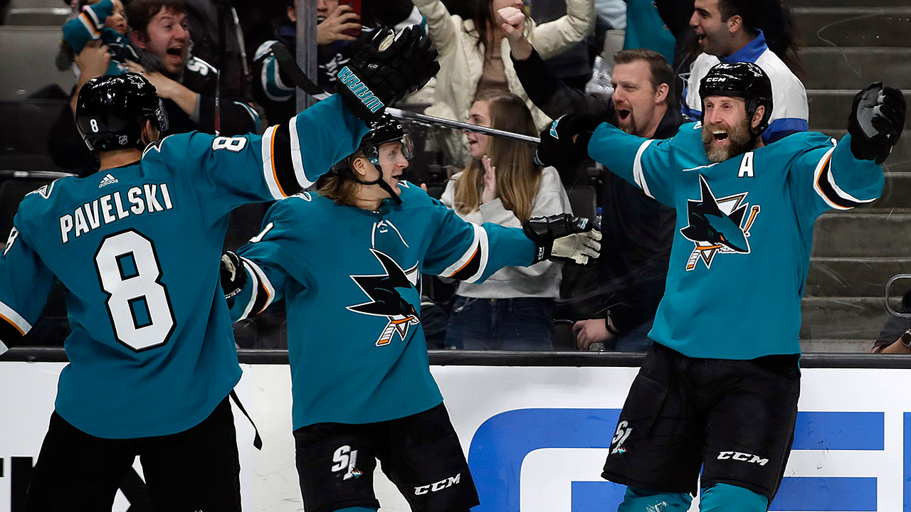 San Jose Sharks players celebrate a goal by forward Joe Thornton (19)  during the second period of an NHL hockey game against the New Jersey Devils,  Sunday, Feb. 12, 2017, in Newark