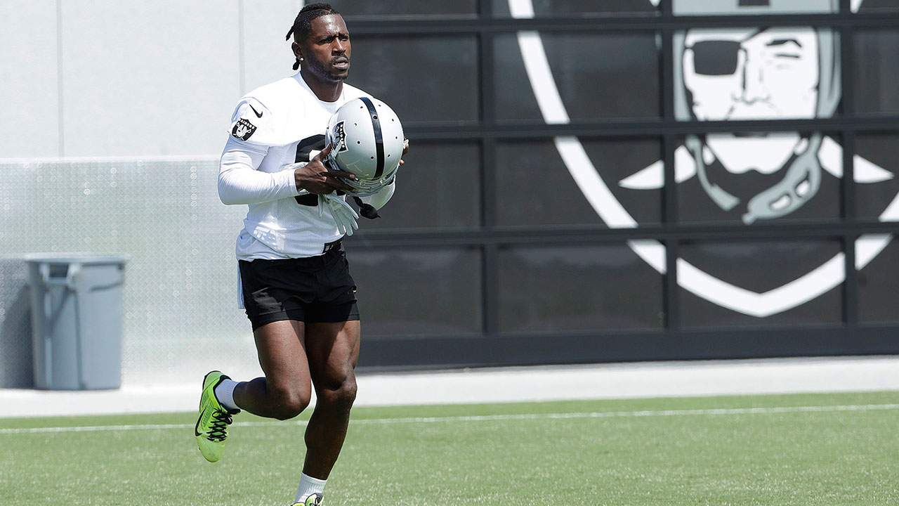 Oakland Raiders wide receiver Antonio Brown holds his jersey