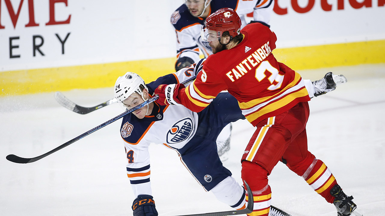 flames-oscar-fantenberg-checks-oilers-brad-malone