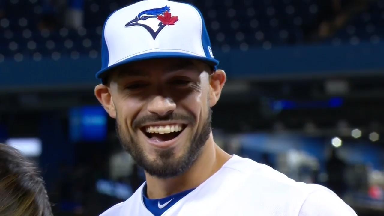 Bo Bichette of the Toronto Blue Jays flicks his hair back after