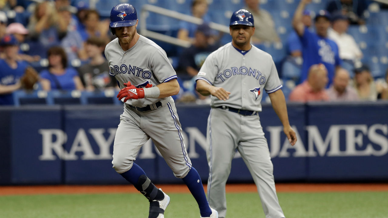 TORONTO, ON - MAY 9: Lourdes Gurriel Jr. #13 of the Toronto Blue Jays looks  on from the top step of the dugout d…