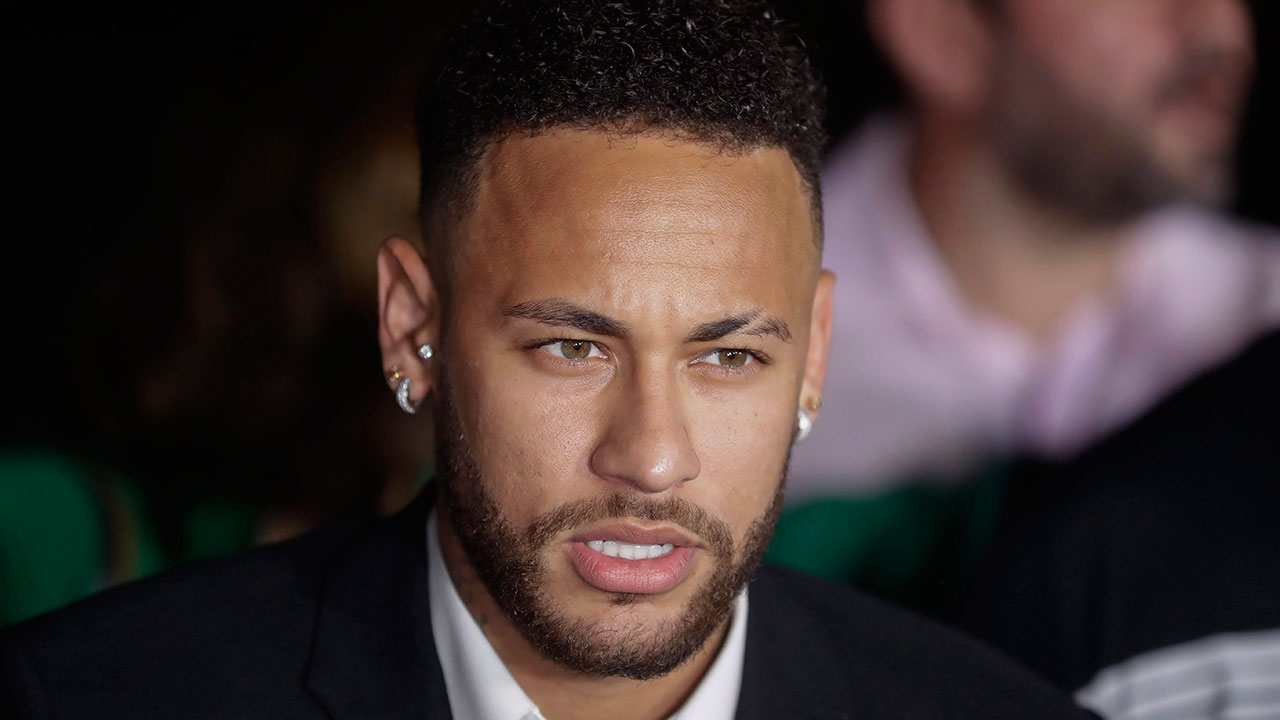 Brazilian soccer star Neymar speaks to the press. (Andre Penner/CP via AP)