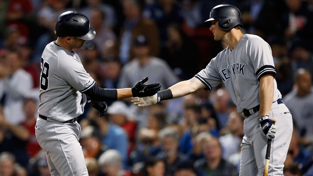 New York Yankees' DJ LeMahieu, left, celebrates with teammates