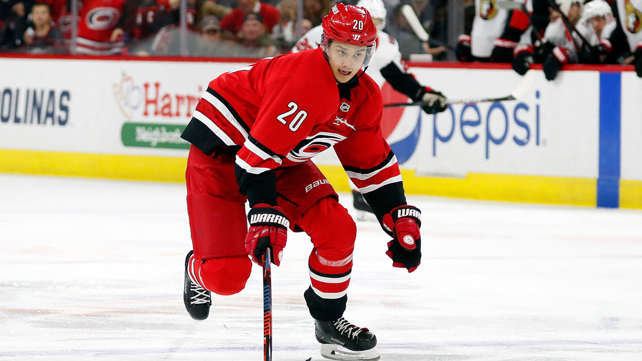 Carolina Hurricanes' Sebastian Aho (20), of Finland, brings the puck up the ice against the Ottawa Senators during the second period of an NHL hockey game.  (AP Photo/Karl B DeBlaker)