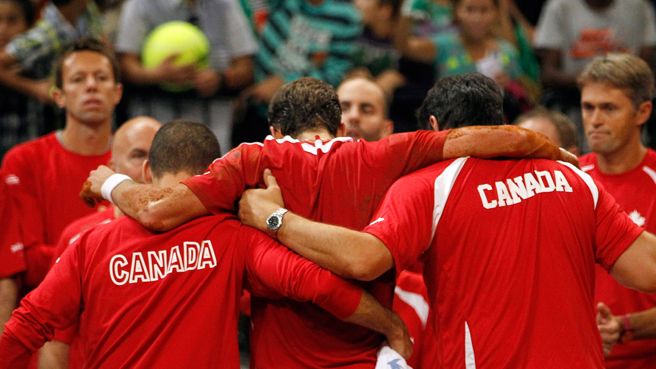 canadas-vasek-pospisil-helped-off-court-by-teammates