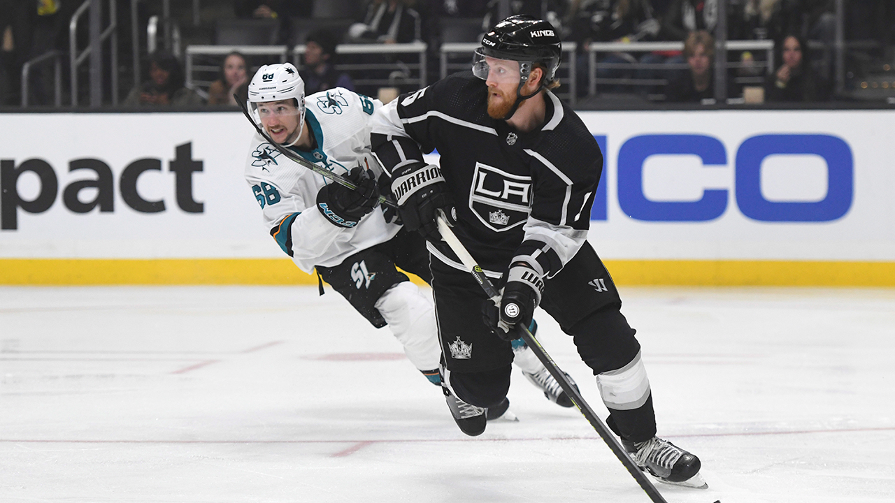 Los Angeles Kings defenceman Joakim Ryan, right, looks to clear the puck as San Jose Sharks center Melker Karlsson (68) pursues during the third period of an NHL hockey game, Monday, Nov. 25, 2019, in Los Angeles. (Michael Owen Baker/AP)