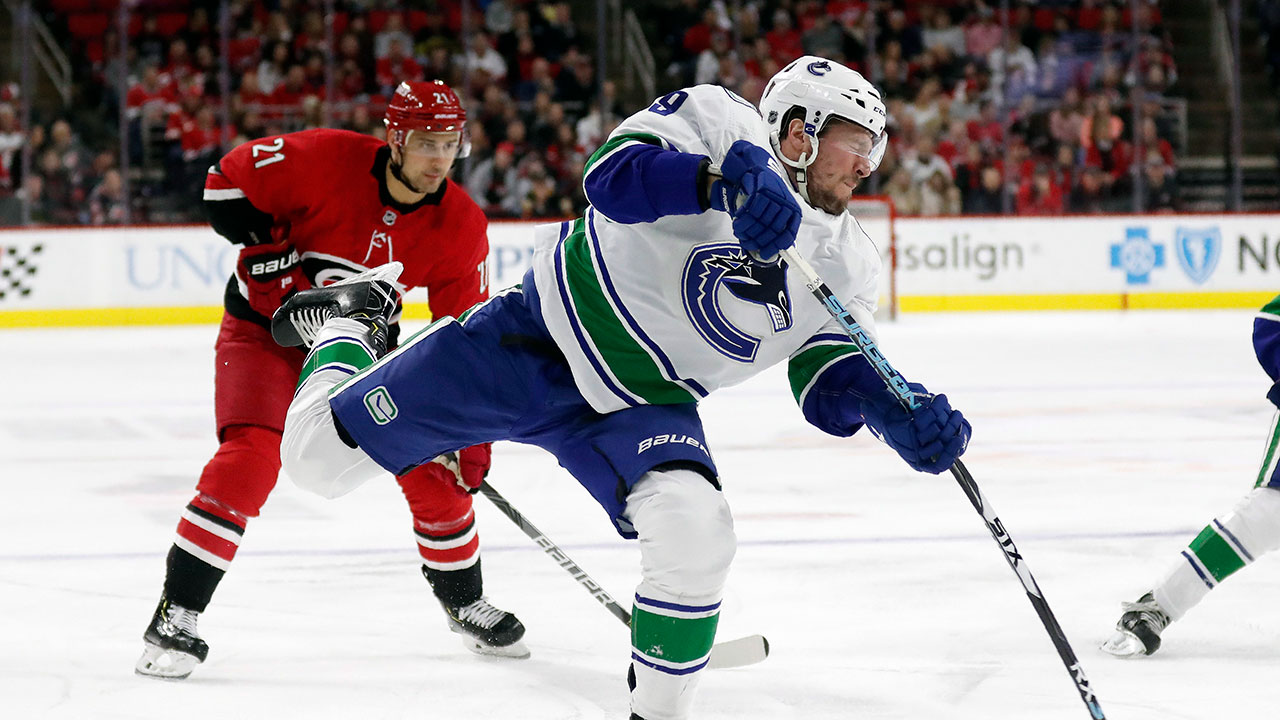 Canucks' battle back to earn a valuable point as t