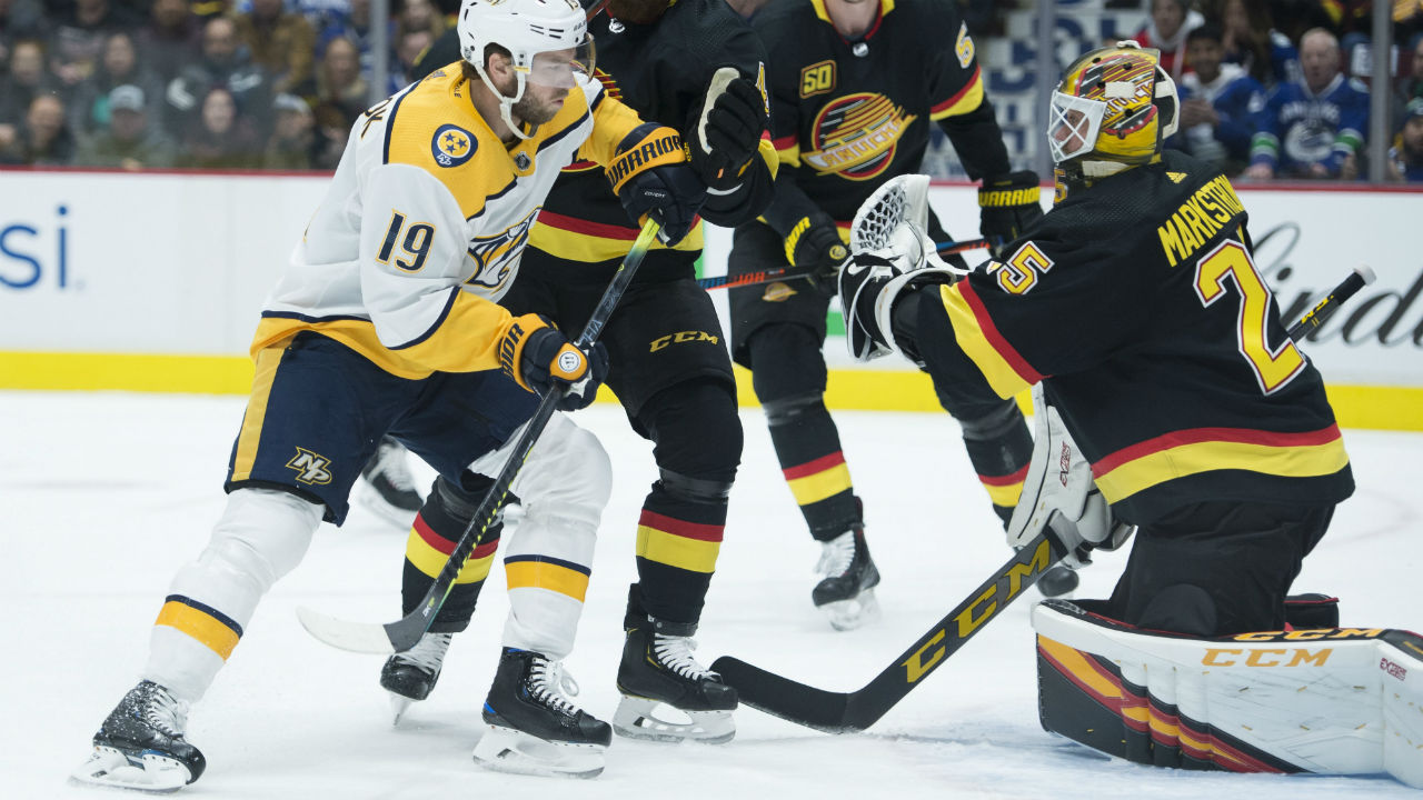 Nashville Predators centre Calle Jarnkrok (19) is stopped by Vancouver Canucks goaltender Jacob Markstrom. (Jonathan Hayward/CP)