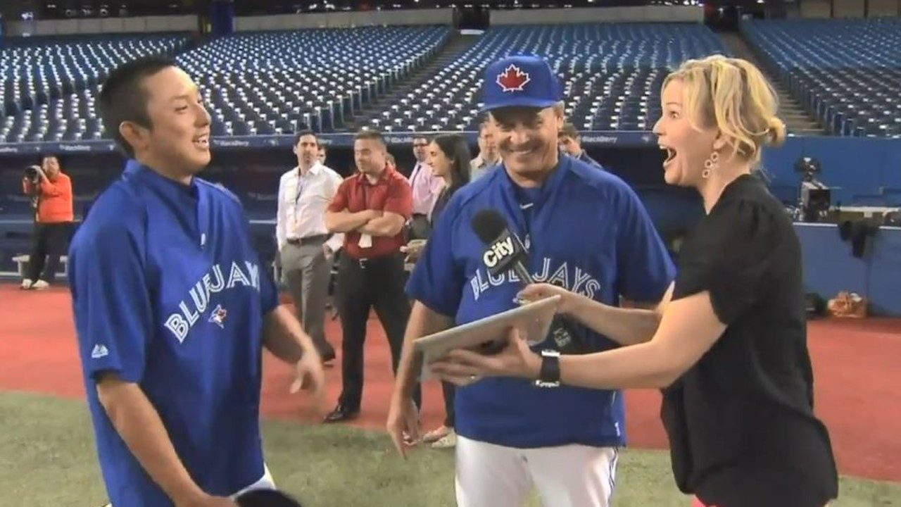 Toronto Blue Jays' Munenori Kawasaki adjusts his cap as he walks