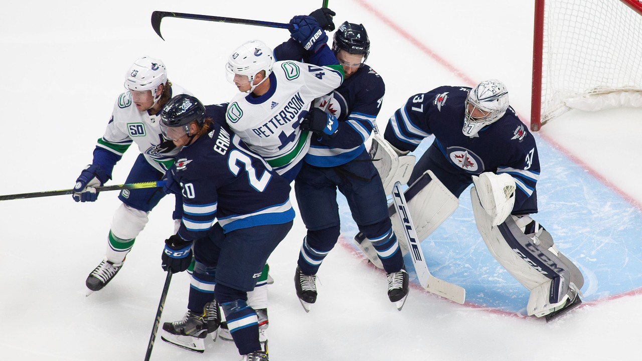 Hellebuyck backstops Jets to win over Canucks in N