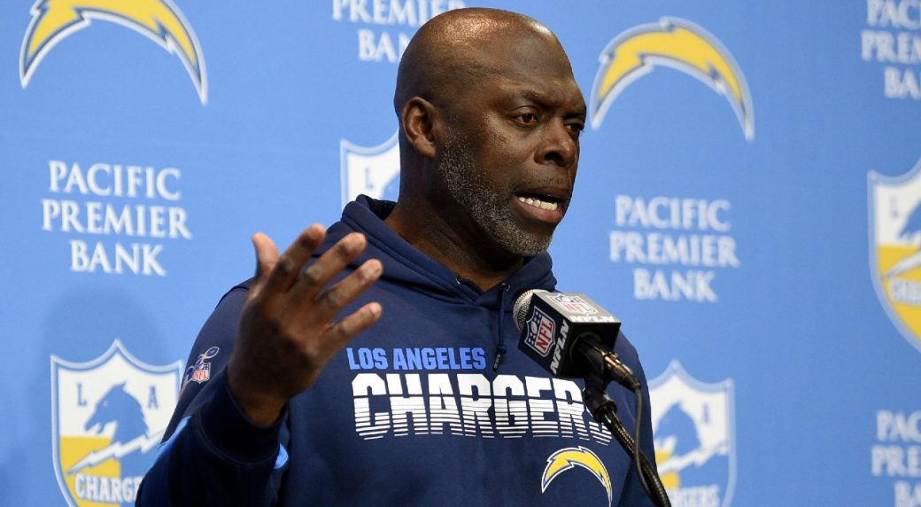 Los Angeles Chargers head coach Anthony Lynn wears a face shield and a  Salute to Service shirt on the field before the Los Angeles Chargers take  on the Miami Dolphins during an