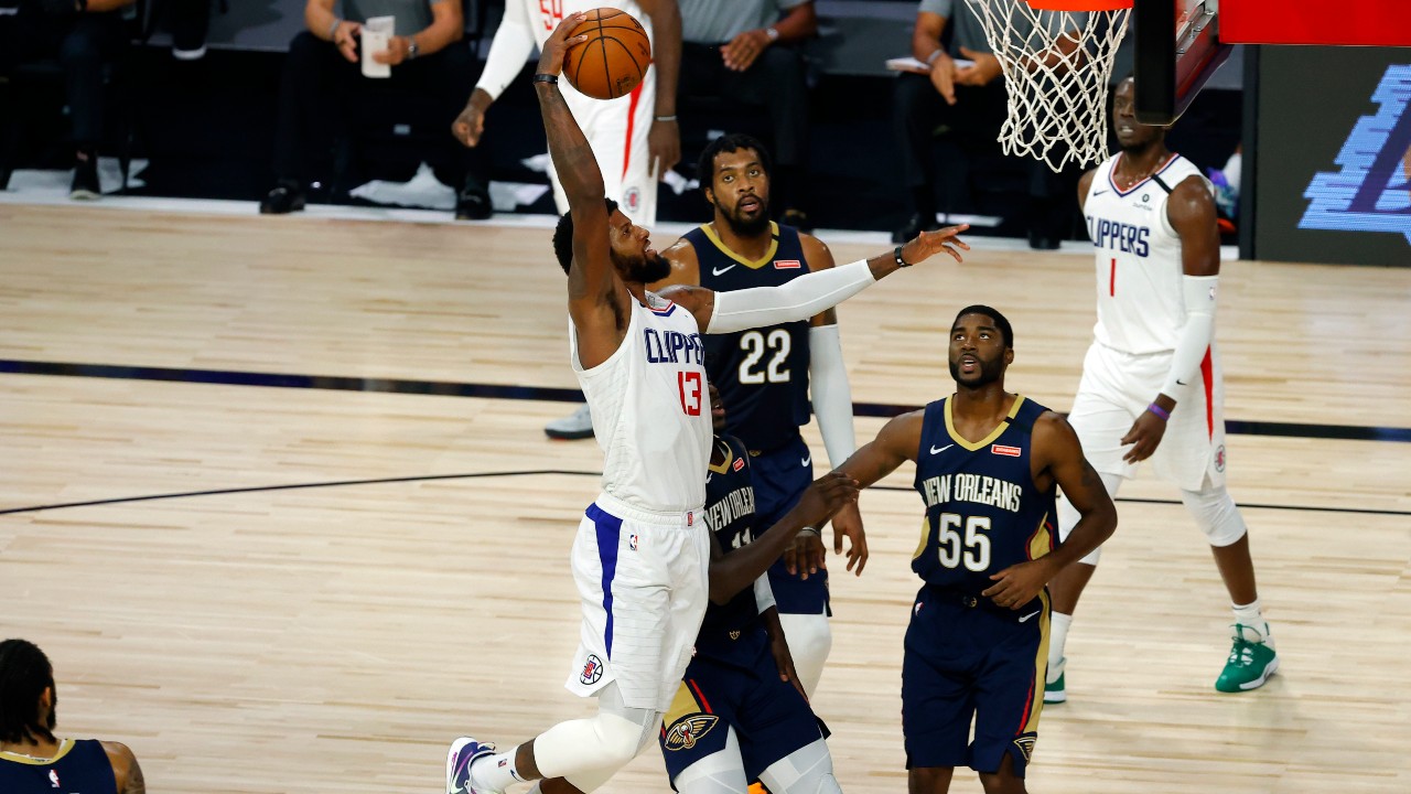 LOS ANGELES, CA - DECEMBER 03: Los Angeles Clippers Guard Paul George (13)  shoots a three pointer during a NBA game between the Portland Trail Blazers  and the Los Angeles Clippers on